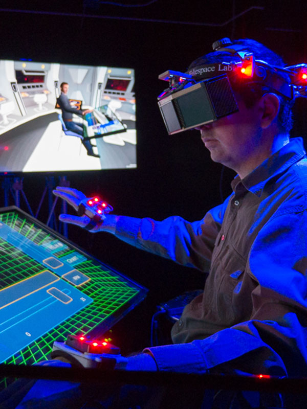 A researcher using the BlueShark prototype to conduct a virtual naval mission.
