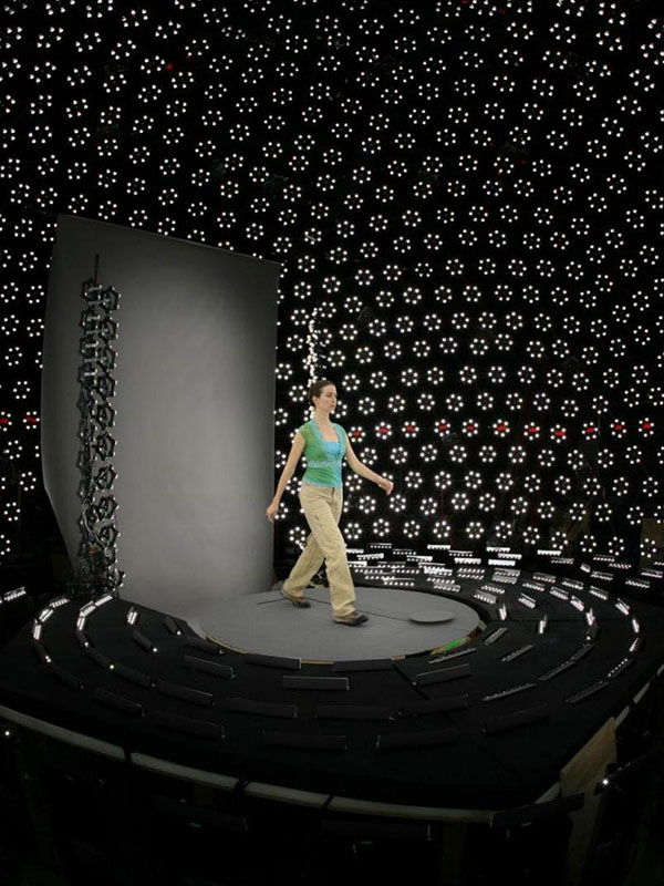 A woman posing in the lightstage for full-body digitization.